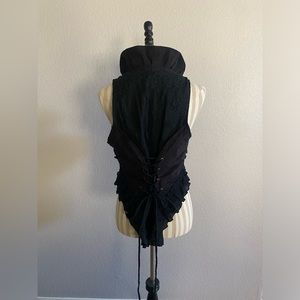 Black ruffle vest